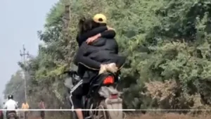 Couple Romance Openly on Bike